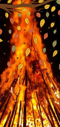 This stunning phone live wallpaper features a bonfire in the center of the screen, surrounded by colorful leaves swept up in the flames