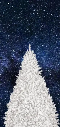 This phone live wallpaper features a stunning white Christmas tree against a snow-covered background