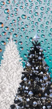 This stunning live wallpaper depicts a colorful Christmas tree set against a snowy backdrop
