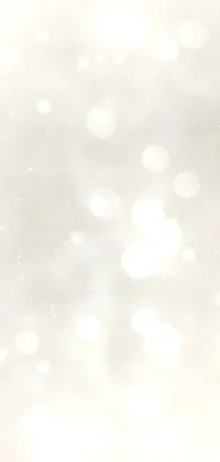 This phone live wallpaper depicts a pair of metallic skis resting on fresh snow with glitter gif, boke, and volumetric light fog elements