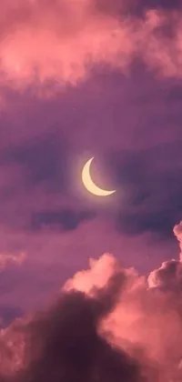 This phone live wallpaper features a beautiful crescent moon shining in the center of a cloudy sky