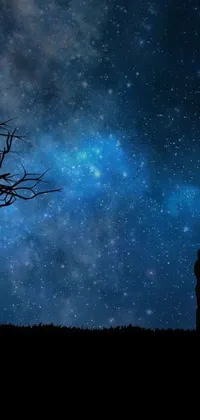 This phone live wallpaper showcases a digital art of a couple standing beneath a large tree, with a starry sky as their background