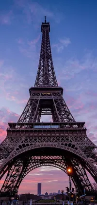 Experience the beauty of Paris with this stunning phone live wallpaper featuring a sunset view of the iconic Eiffel Tower