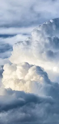 This cloud-themed live wallpaper features a jetliner flying through the sky amid a sea of cumulus clouds - perfect for fans of aviation