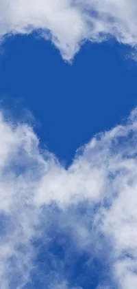 This phone live wallpaper displays a lovely heart-shaped cloud in a serene blue sky