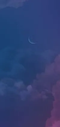This mobile phone live wallpaper showcases a mesmerizing night sky with drifting clouds and a crescent moon
