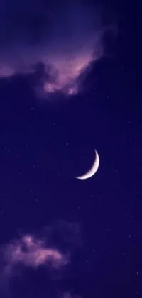 Enjoy the serene beauty of a crescent moon and clouds in the night sky with this stunning live wallpaper for your phone