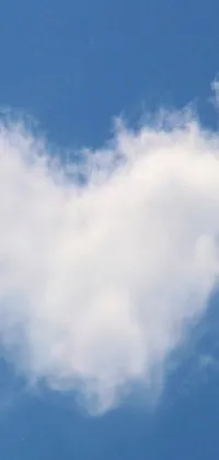 Looking for a dreamy and romantic live wallpaper for your phone? This one features a fluffy heart-shaped cloud gliding gracefully in the serene blue sky