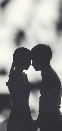 This romantic phone live wallpaper features a beautiful black and white photograph of a couple standing close to each other
