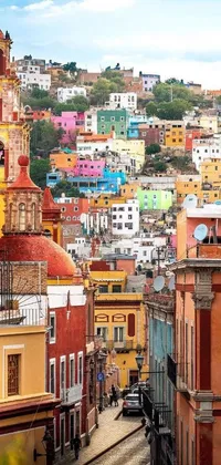 This live wallpaper depicts a colorful and vibrant cityscape inspired by the buildings of Mexico