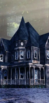 This phone live wallpaper features a spooky image of a large wooden house situated in the midst of a dense forest