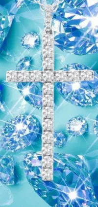 This lively phone wallpaper showcases a striking cross design encircled by glistening diamonds placed on a beautiful blue backdrop, creating an enchanting visual effect that is sure to captivate anyone's gaze