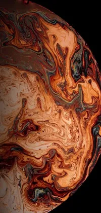 This live wallpaper showcases beautiful digital art of an orange gas giant with a brown water foreground on a wooden surface, with black and auburn tones