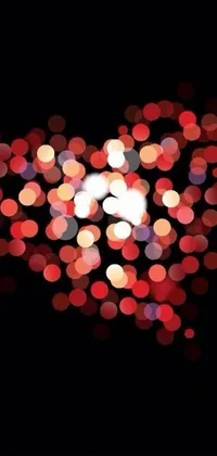 This stunning phone live wallpaper features a heart-shaped arrangement of lights that flicker and change colors, adding a mesmerizing effect to your phone screen