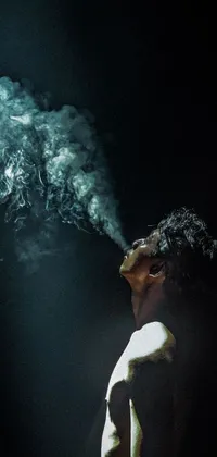 This striking phone live wallpaper showcases a man smoking in the dark, with a digital art style and shot from below