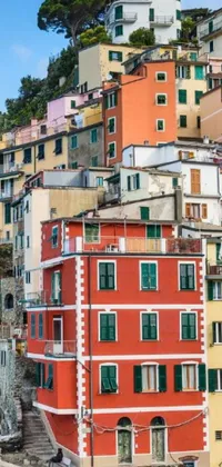 Get your phone live wallpaper featuring a colorful tiled architecture of buildings stacked on a hilly terrain