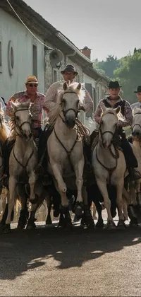 Bring a sense of adventure to your phone screen with this exciting live wallpaper! Featuring a group of men riding horses down a street in Transylvania, this wallpaper was inspired by a shot from a popular movie