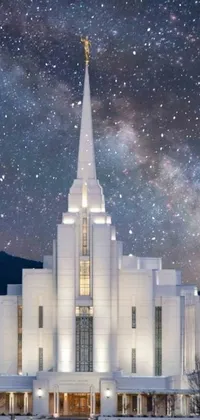 Immerse yourself in the stunning beauty of the Mormon Live Wallpaper! This digitally rendered wallpaper showcases the grandeur of Mormon temples against a milkyway backdrop in a beautifully crafted Art Deco style