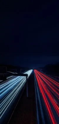 If you're looking for the perfect phone wallpaper, look no further than this stunning long exposure photograph of a nocturnal highway