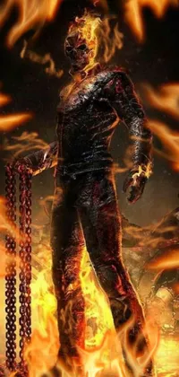 This phone live wallpaper features a fiery digital rendering of a man standing in front of a blazing inferno