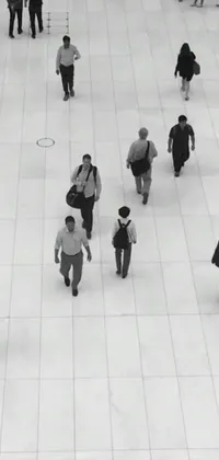 This mobile live wallpaper showcases a group of people walking across a white tiled floor in a modern and minimalist style