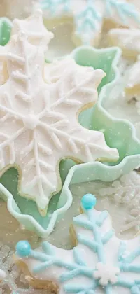 Snowflake and frosting-covered table with a mouth-watering display of cookies in high detail makes for a delightful live wallpaper on your phone