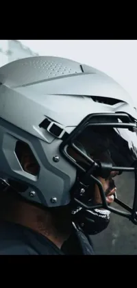 This modern phone live wallpaper features a close-up of a gray helmet designed for intense activities