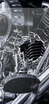 This dynamic live wallpaper showcases a stunning black and white photo of a motorcycle engine, featuring intricate detailing and textures that bring it to life