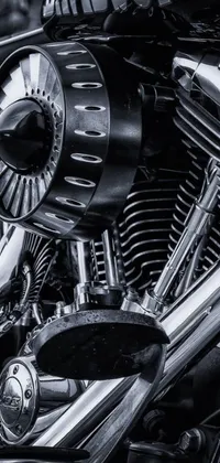 This live wallpaper features a striking black and white photo of a motorcycle engine