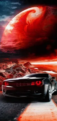 Enhance your phone display with this stunning live wallpaper featuring a muscle car cruising along a winding road with an awe-inspiring planet in the background