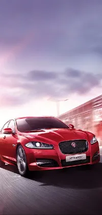 This phone live wallpaper features a red jaguar parked on the side of a road