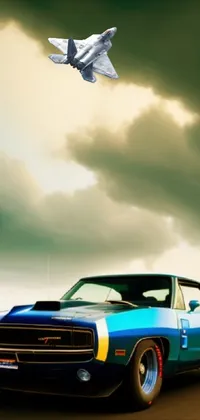 This stunning live wallpaper features a digital rendering of a vintage blue car driving down a winding road under a cloudy sky