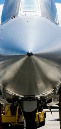 This live wallpaper depicts a fighter jet parked on an airport tarmac, with remarkable depth detail visible in the frame