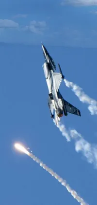 This dynamic phone live wallpaper features a fighter jet speeding through a brilliant blue sky and a powerful explosion captured in hurufiyya artwork