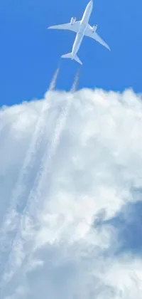 This phone live wallpaper shows a large jetliner flying through a cloudy blue sky, leaving a white vapor trail behind it