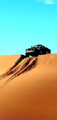 This live wallpaper features a truck resting in the sand amidst a desert landscape