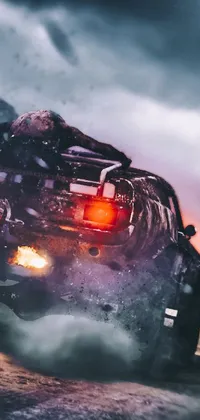 Looking for an exciting live wallpaper for your phone? Check out this stunning four-wheeler vehicle wallpaper featuring a man riding on the back