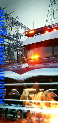This live wallpaper features a stunning image of a parked truck in the snow with flashing police lights in the background
