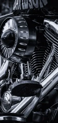 This live phone wallpaper is a detailed black and white photograph of a motorcycle