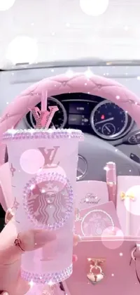 This phone live wallpaper features a vibrant pink purse resting on a car's leather interior