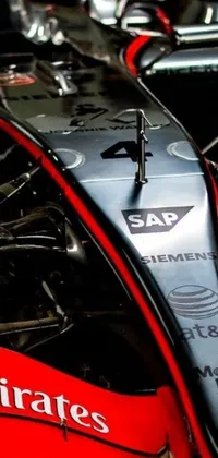 This phone live wallpaper showcases a captivating close-up shot of a race car's front end