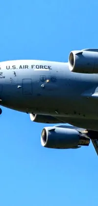 Watch a captivating scene come to life on your phone with this live wallpaper featuring an air force jet soaring through a beautiful blue sky