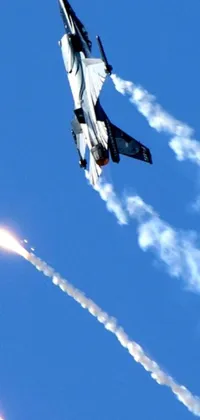 This live wallpaper features a fighter jet soaring through a blue sky, leaving a trail of white smoke behind