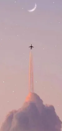 Bring your phone screen to life with a stylish live wallpaper featuring a plane soaring against a beautiful nighttime sky