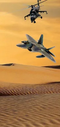 Brighten up your phone's screen with this stunning live wallpaper featuring vibrant planes soaring across a deep golden sand desert and bright blue sky with fluffy clouds
