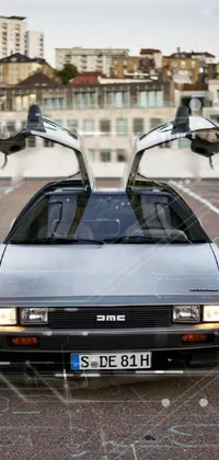 This phone live wallpaper showcases a retrofuturistic parking lot with a parked Delorean car and open doors