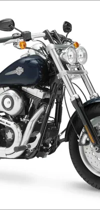 Looking for a sleek and powerful live wallpaper for your phone? Look no further than this image of a black and chrome Harley Davidson motorcycle by Ben Zoeller
