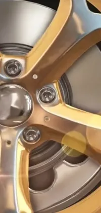 This phone wallpaper showcases a hyperreal brass wheel on a car, boasting a trendy industrial aesthetic