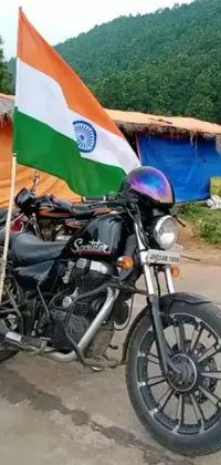Enhance the look of your phone with this charming live wallpaper showing two motorcycles parked next to each other, against a waving Indian flag backdrop