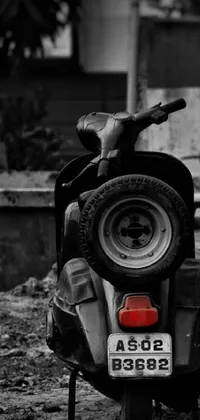 This phone live wallpaper showcases a black and white close-up shot of a rugged motor scooter